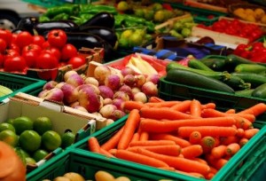 Fresh assorted vegetables in boxes on farmer's market